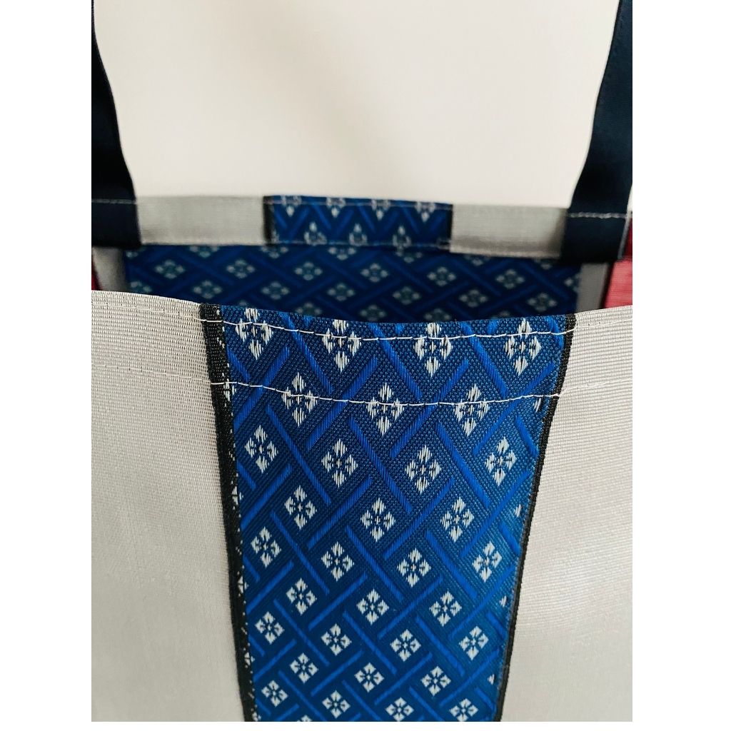 Close up image of woven fabric, Silver Stripe and Blue Stripe with Diamond Shaped Designs - So cool! Designs are woven not printed! Japanese Vibe, Super Durable Fabric, Double Stitched Handles, Shoulder Straps, Heavy Duty Stitching on Corners and Seams. Long lasting Sustainable Tote Bags ShimaShima Bags