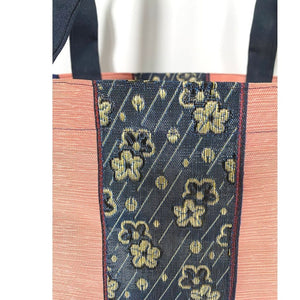 Close up image of woven fabric, Pink and Navy Blue, Sakura Cherry Blossom Floral Design, Japanese Vibe, Super Durable Fabric, Double Stitched Handles, Shoulder Straps, Heavy Duty Stitching on Corners and Seams. Long lasting Sustainable Tote Bags ShimaShima Bags